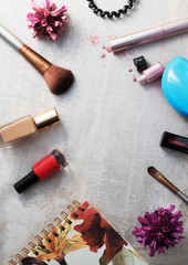 Beauty products, everyday makeup vibrant background, top view