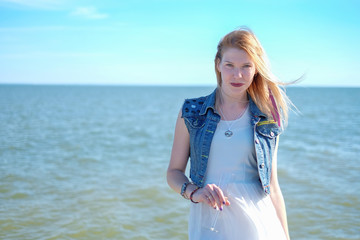 Beautiful woman relaxed near the sea. Summer day