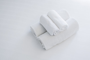white towel on white bed
