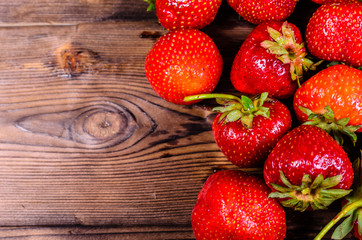 Ripe strawberries on wooden table. Top view