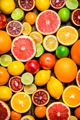 Schilderijen op glas Citrus background. Fresh citrus fruits - Lemons, oranges, limes, grapefruits. © Artem Shadrin