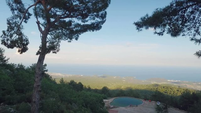 moving shot, view on turkish seacoast near Kemer from high mountain Tahtali, in sunny weather