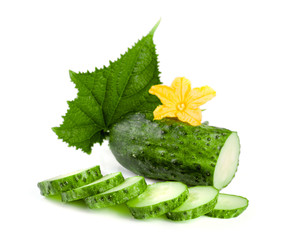 Sliced cucumber with leaf and flower isolated on a white background