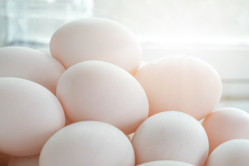 Fresh duck eggs in bamboo basket.