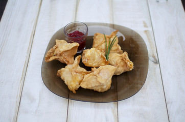 Deep-fried manti. Deep-fried pies. Pies with meat and ketchup. High-calorie food. Snack.   Carbohydrate food