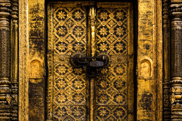 abstract background of golden door crafted by golden texture locked by vintage lock