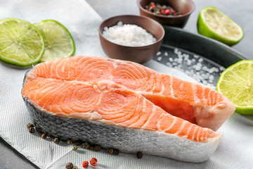 Baking dish with fresh salmon steak and spice, closeup
