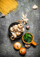 Pasta background. Spaghetti with fresh mushrooms, onions and green parsley.