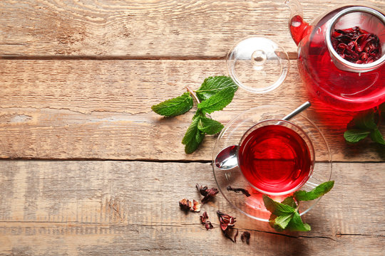 Composition with hibiscus tea on wooden table. Weight loss concept