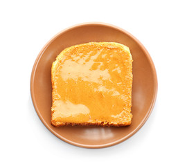 Plate with peanut butter sandwich on white background