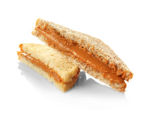 Tasty sandwiches with creamy peanut butter on white background