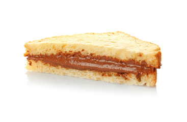 Tasty sandwich with creamy peanut butter on white background