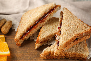 Tasty sandwiches with peanut butter and jam, closeup