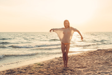 Fototapeta na wymiar Woman is alone at beach