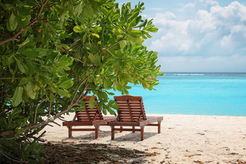 Obraz premium Sun loungers on beach at sea resort