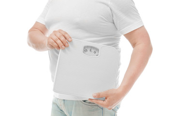 Overweight man holding weight scales on white background. Diet concept