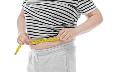 Overweight man measuring his waist on white background. Diet concept