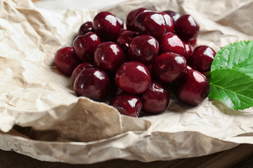 Closeup of ripe cherries on parchment paper