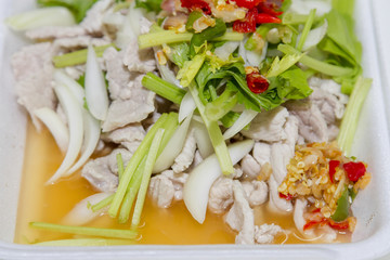Thai food, lemon pork in white foam box