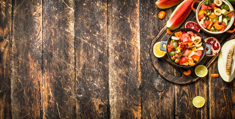 Summer food . Salad of tropical fruits.