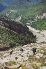 Fototapeta premium Tourists on the mountain trail