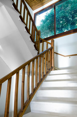 Interior, wooden staircase with marbles and window