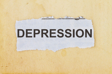 Depression word written on a newspaper cut out
