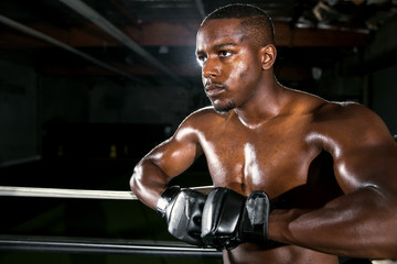 Fototapeta na wymiar Tough serious glare stare look from a strong buff fighter looking mean