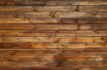 Background of natural knotted wood fence. Wooden texture.