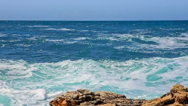 Rocky shore of the Adriatic sea after storm slow motion from 120fps