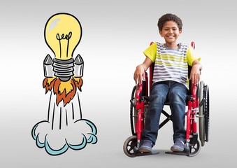 Disabled boy in wheelchair with colorful light bulb rocket