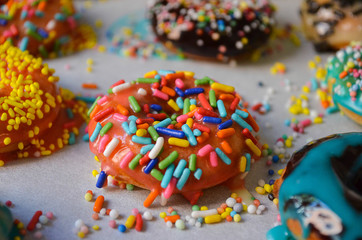 American donuts with the colorful crumbs sprinkled on the top. Colorful crumbs are giving amazing look to the american donuts.