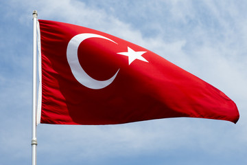 Turkish flag flown by day