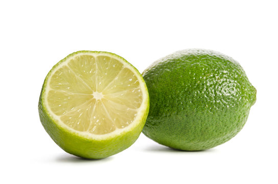 Juicy limes over the white background
