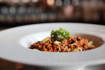 Spaghetti bolognese in dark tone