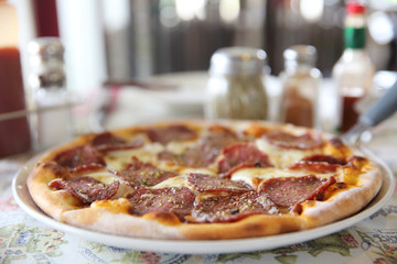 Pepperoni pizza , pizza with pepperoni mozzarella cheese and tomatoes with sauce background italian food