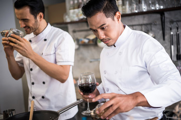 Chef preparing food in the kitchen of a restaurant  