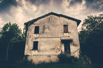 Fototapeta na wymiar Haunted abandoned house in the woods