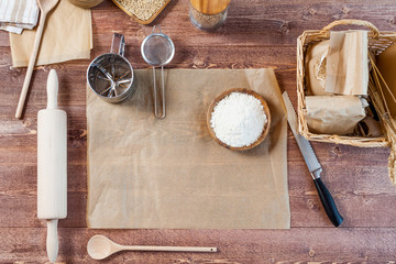 wheat and flour on rustic wooden table, top view, copy space