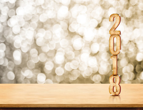 2018 new year wood number (3d rendering) on wood table with sparkling gold bokeh wall,leave space for display or montage of product.