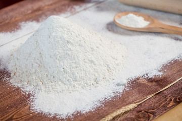 wheat and flour on rustic wooden table