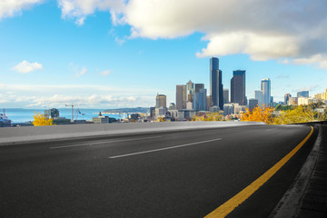 Fototapeta premium empty road with cityscape of modern city