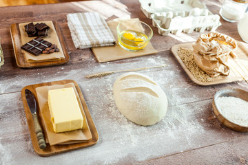fresh dough on kitchen  rustic wooden table.