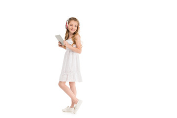 Naklejka premium child in headphones with tablet