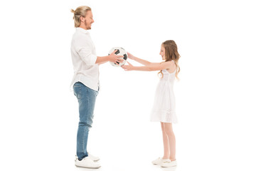 father and daughter with soccer ball