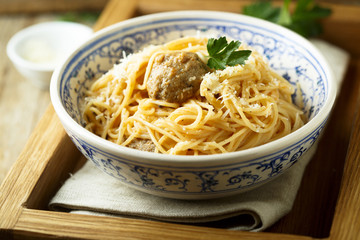 Spaghetti with meatballs, cheese and tomato sauce