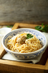Spaghetti with meatballs, cheese and tomato sauce