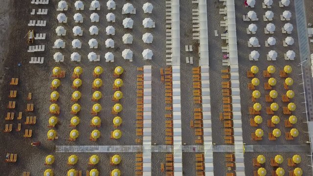 Riccione, Italy, August 8, 2017. Drone aerial view of the umbrellas and gazebos on Italian sandy beaches. Adriatic coast. Emilia Romagna region