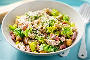 Chicken caesar salad with bacon and herb croutons  - obrazy, fototapety, plakaty