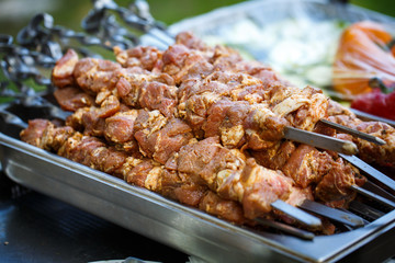 fresh meat on skewers ready to cook on grilling.